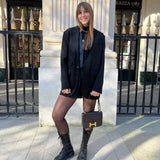 Look avec veste de costume, gilet et short en popeline à carreaux