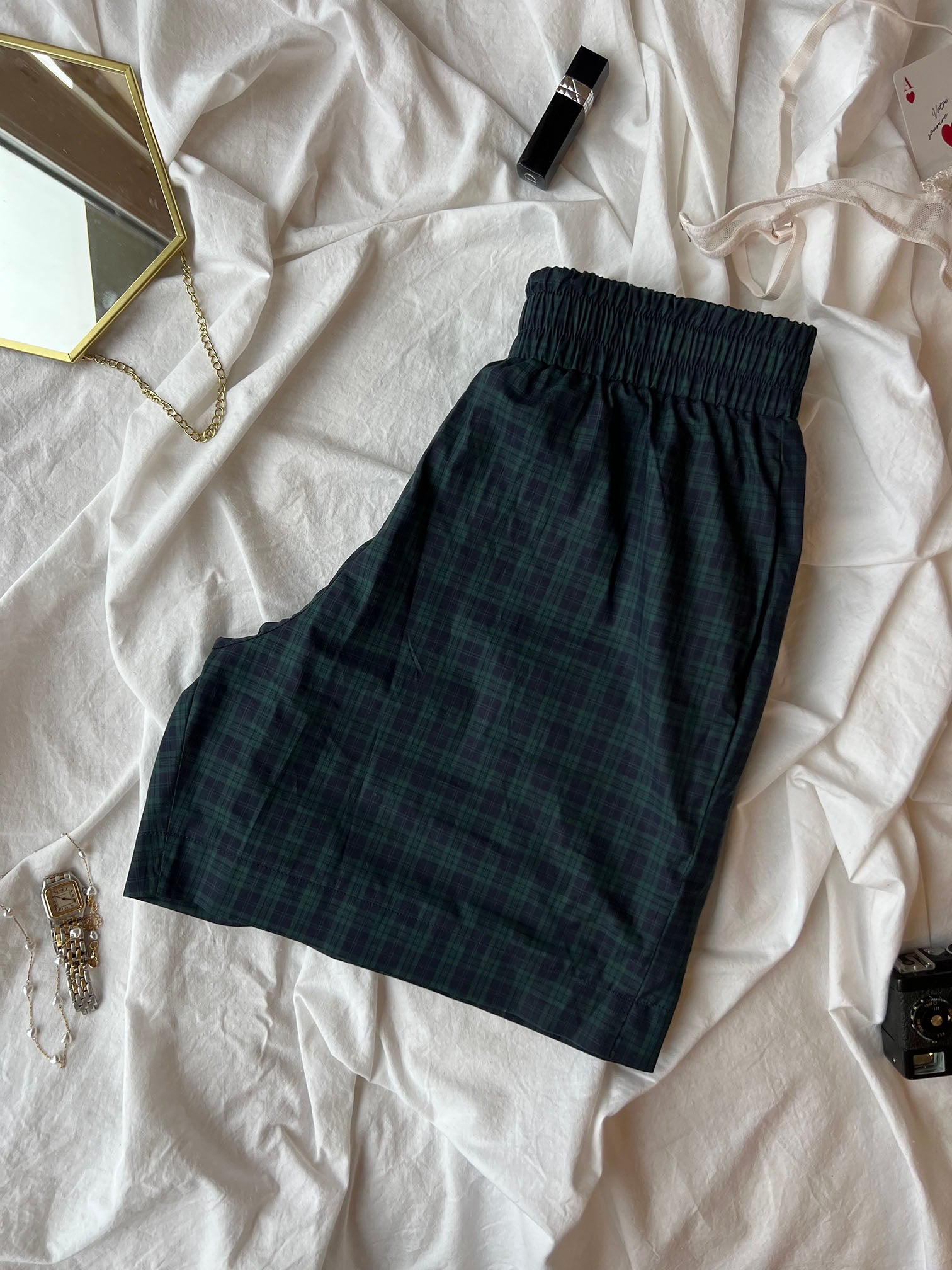 Short en popeline vert à carreau homme plié 