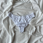 Tanga, culotte en jersey pointelle blanc posé